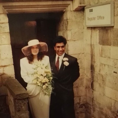 Tasie Lawrence's parents, Derek Dhanraj and Rebecca Sinnatt, in their wedding outfit.